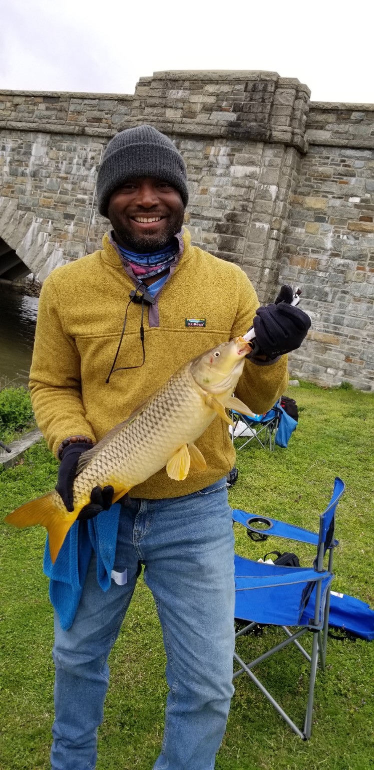 William Storm holding a fish after a successful day on the water